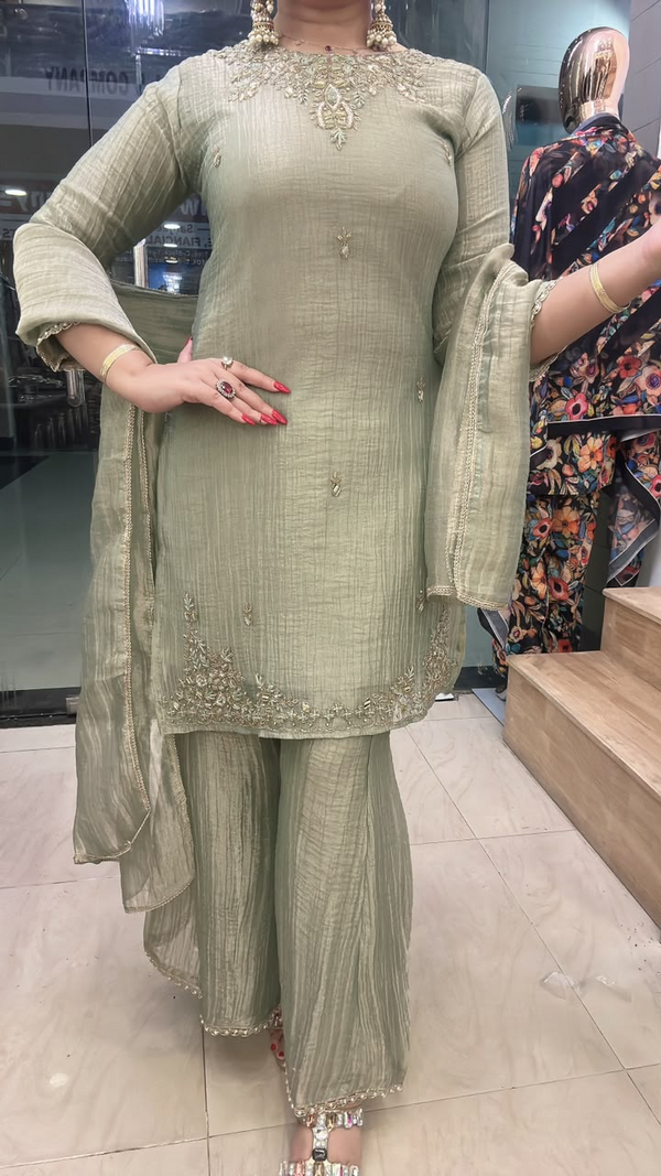Crush shimmer gharara suit with embroidered neckline and hem close view