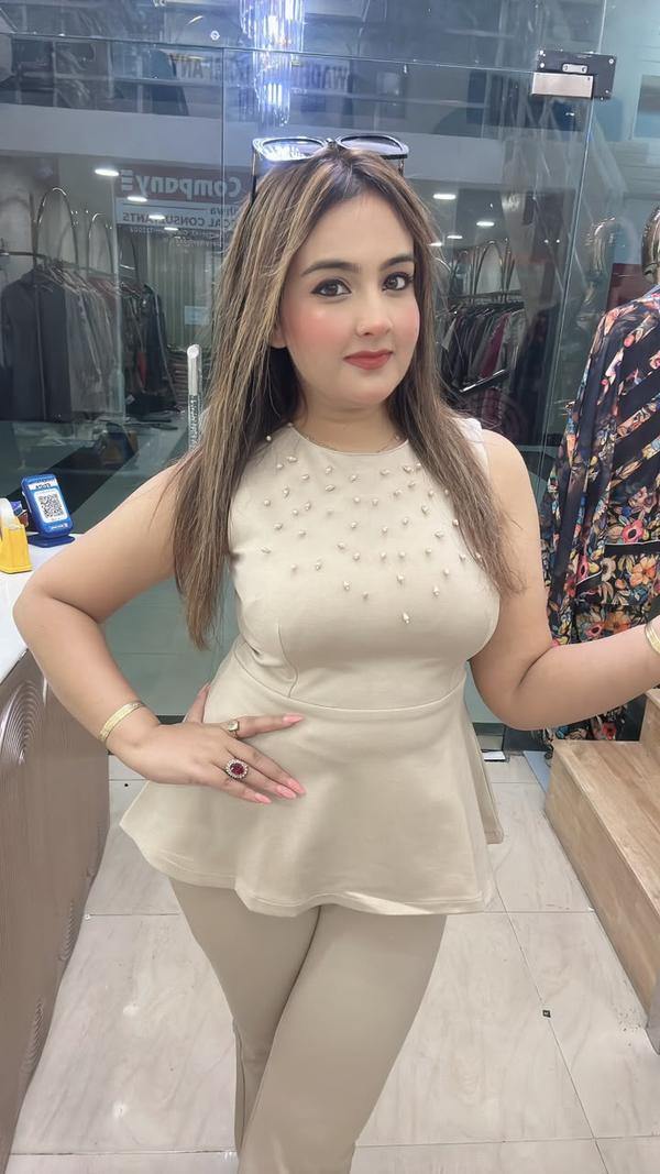 Beige lycra cord set with pearl work sleeveless top close view